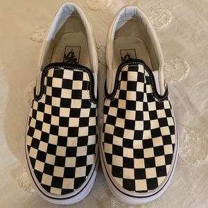Vans black/off-white checkerboard slip on’s